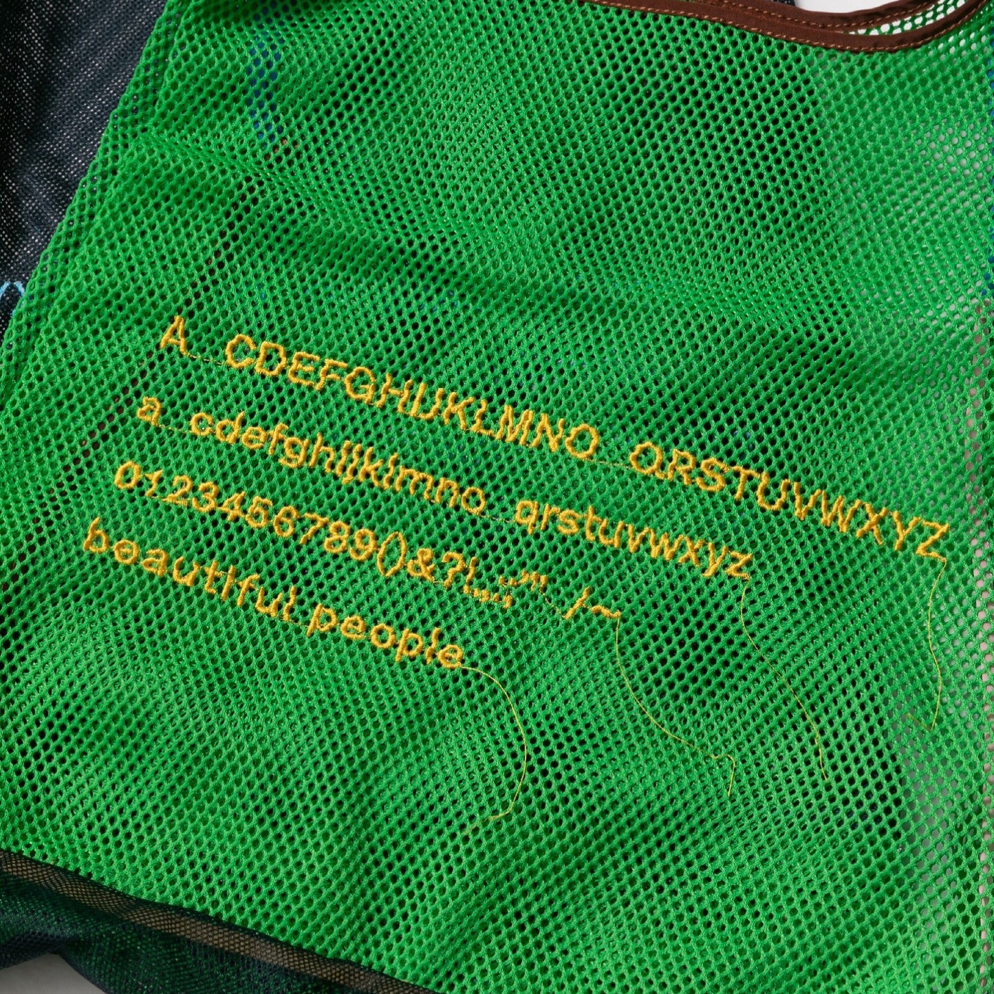 alphabet embroidely marche flip bag