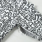 ナイロンタフタラミネートプリント Keith Haring J016